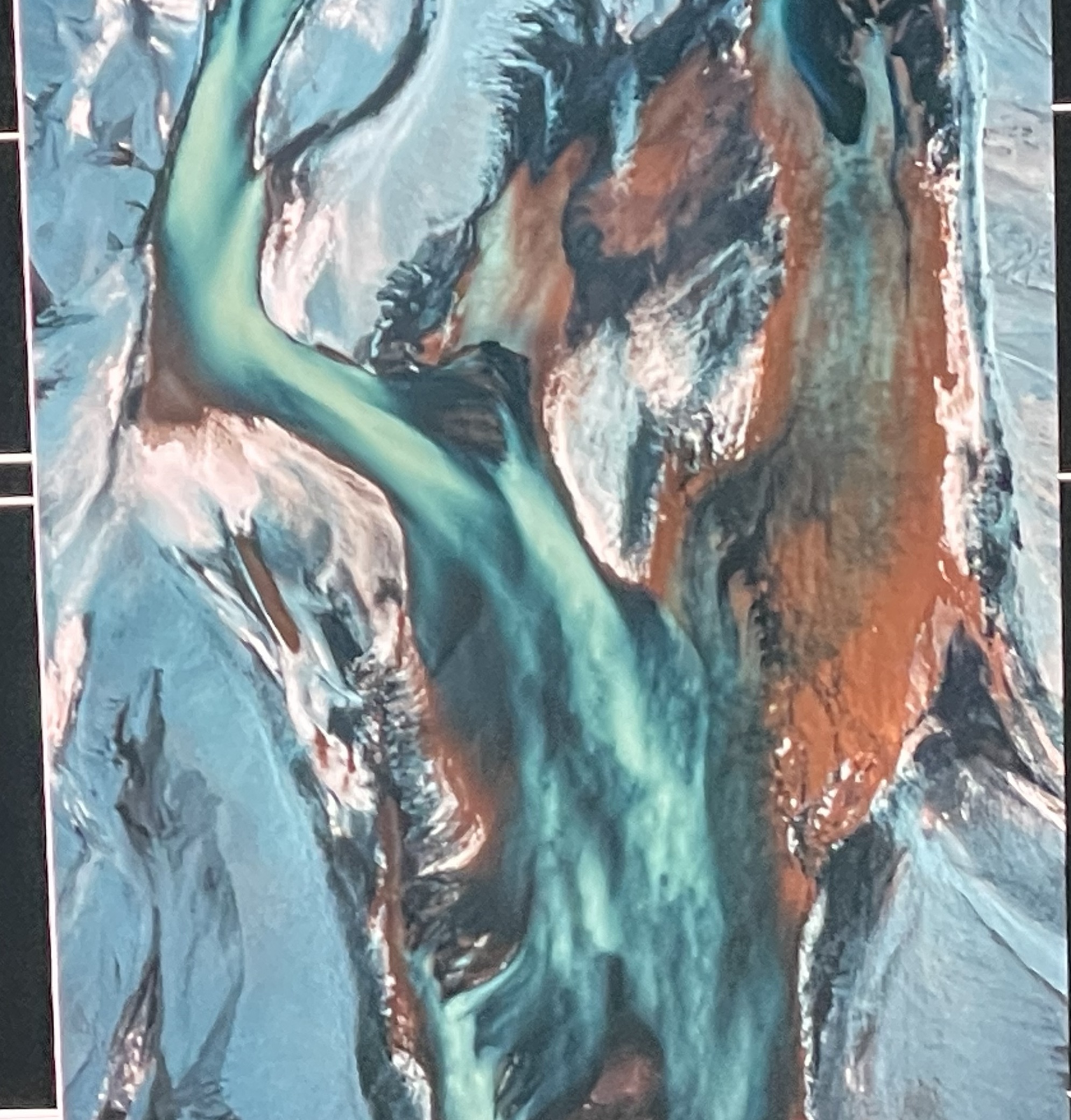 Aerial river delta, transformed into glowing turquoise and copper channels