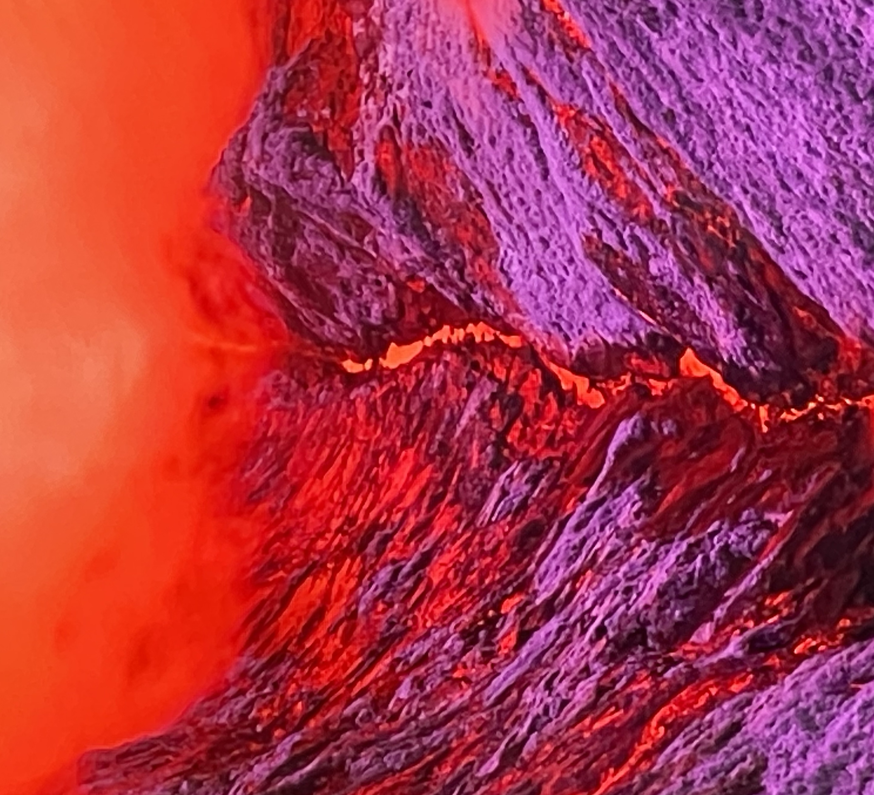 Mountain ridge with a glowing molten crease running down its center